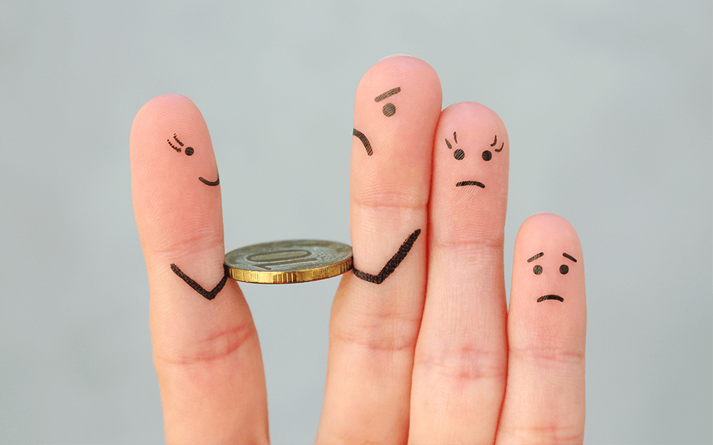 A hand holding a coin with its 2 fingers fighting over it.